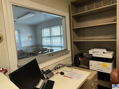 This charming small office building is the perfect canvas for