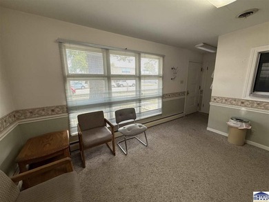 This charming small office building is the perfect canvas for