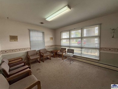 This charming small office building is the perfect canvas for