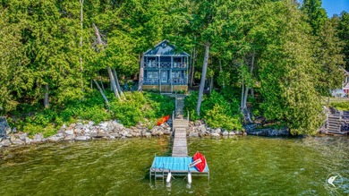 Set on the shores of Lake Champlain in Westport, this classic - photo 1
