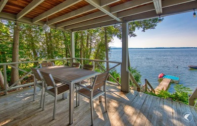 Set on the shores of Lake Champlain in Westport, this classic - photo 2