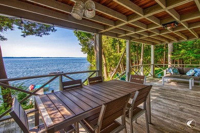 Set on the shores of Lake Champlain in Westport, this classic - photo 3