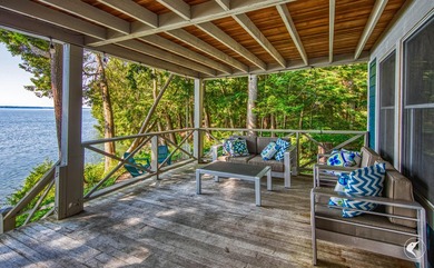Set on the shores of Lake Champlain in Westport, this classic - photo 4