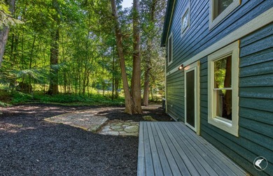 Set on the shores of Lake Champlain in Westport, this classic - photo 5