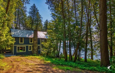 Set on the shores of Lake Champlain in Westport, this classic - photo 8