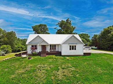 Perched on nearly 4 acres with sweeping views of Dale Hollow - photo 1