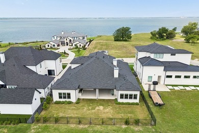 Discover elevated lakeview living in the prestigious Heath Golf - photo 2