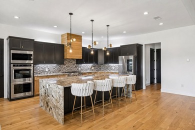 Discover elevated lakeview living in the prestigious Heath Golf - photo 5
