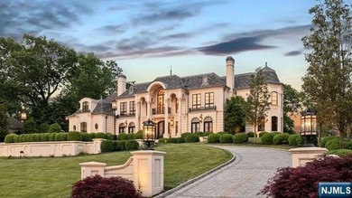 Welcome to this custom-built estate situated high atop the - photo 2
