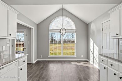 Beautiful brick ranch on a level 1 acre lot in the highly