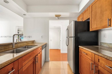 Sleek city living meets unmatched convenience in this updated - photo 3