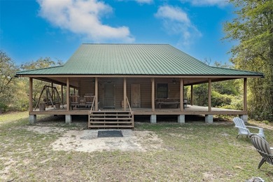 This authentic rustic log cabin retreat is tucked away at the - photo 2