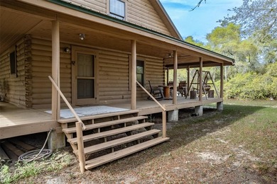 This authentic rustic log cabin retreat is tucked away at the - photo 3