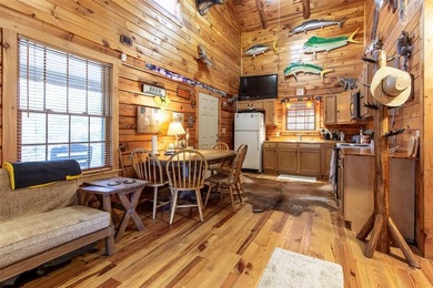 This authentic rustic log cabin retreat is tucked away at the - photo 4