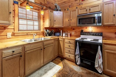 This authentic rustic log cabin retreat is tucked away at the - photo 5