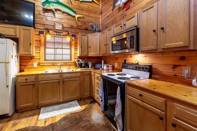 This authentic rustic log cabin retreat is tucked away at the - photo 6