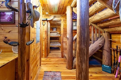 This authentic rustic log cabin retreat is tucked away at the - photo 10
