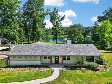Nestled along the peaceful shores of Swan Lake, this beautifully - photo 6