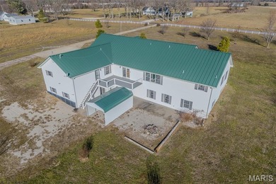 Versatile Estate on 9.8 Acres with Dual Living Quarters & Income