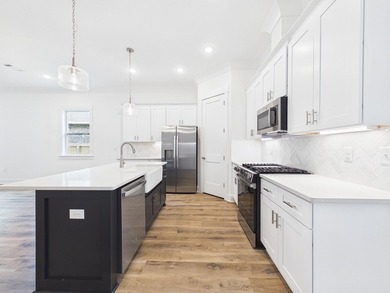 This spacious single-story residence offers a seamless blend of - photo 3