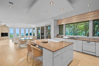 Set high on a scenic bluff in New Seabury, this contemporary - photo 13