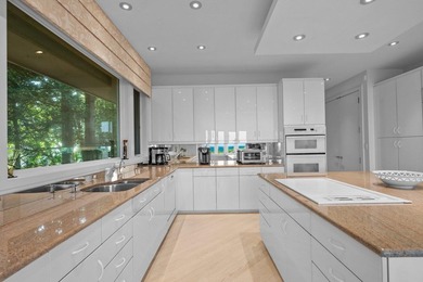 Set high on a scenic bluff in New Seabury, this contemporary - photo 14