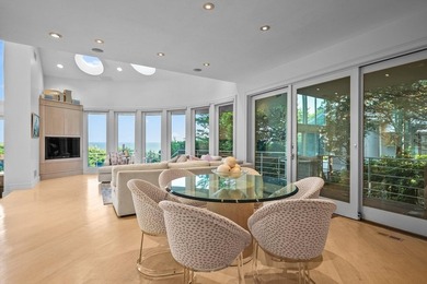 Set high on a scenic bluff in New Seabury, this contemporary - photo 16