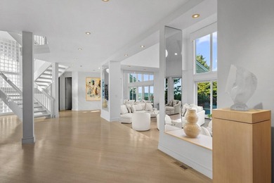 Set high on a scenic bluff in New Seabury, this contemporary - photo 18
