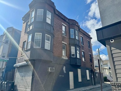 This is a triplex with a lot of potential. The building has 2 - photo 1