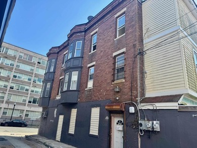 This is a triplex with a lot of potential. The building has 2 - photo 2