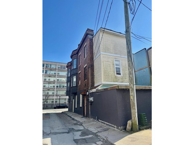 This is a triplex with a lot of potential. The building has 2 - photo 3