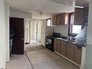 This is a triplex with a lot of potential. The building has 2 - photo 8