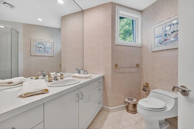 Set high on a scenic bluff in New Seabury, this contemporary - photo 29