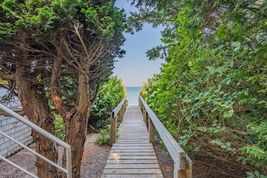 Set high on a scenic bluff in New Seabury, this contemporary - photo 37