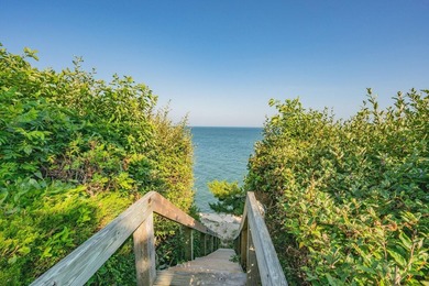 Set high on a scenic bluff in New Seabury, this contemporary - photo 38