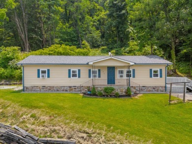 Perched on a gentle hillside with sweeping views of the valley - Lake Home For Sale in Sevierville, Tennessee