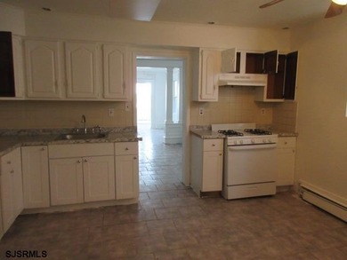 Spacious 4-bedroom, 2-bath attached single-family home located - photo 5