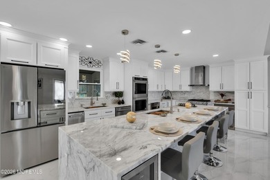 This fully renovated home sits on just under 2 acres with a pool - photo 3