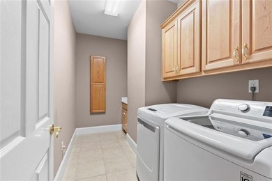 This exquisite four-sided blush brick estate is the epitome of - photo 30