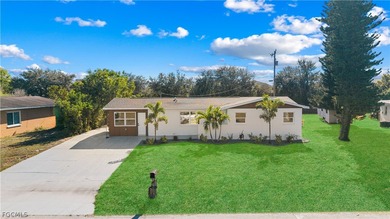 Lake Home For Sale in Lehigh Acres, Florida