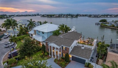 Perfectly positioned within the exclusive waterfront enclave of - photo 1
