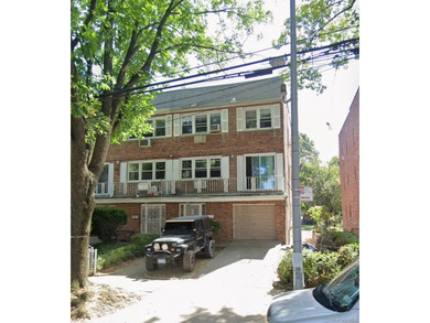 Excellent investment 3-Family brick home at 150-22 Roosevelt Ave - photo 1