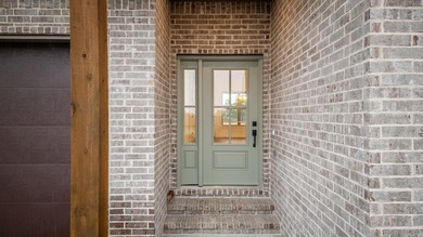 This beautifully constructed new home offers peaceful views of - photo 2