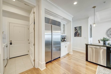 This extraordinary waterfront end unit condo, nestled in the - photo 4