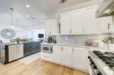 This extraordinary waterfront end unit condo, nestled in the - photo 5