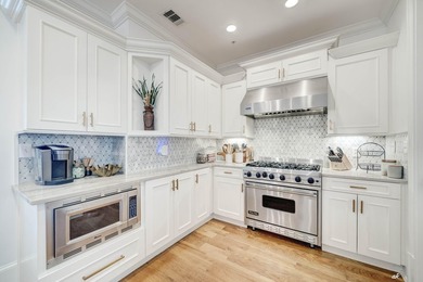 This extraordinary waterfront end unit condo, nestled in the - photo 6