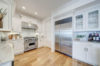 This extraordinary waterfront end unit condo, nestled in the - photo 7