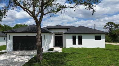 Lake Home For Sale in Lehigh Acres, Florida