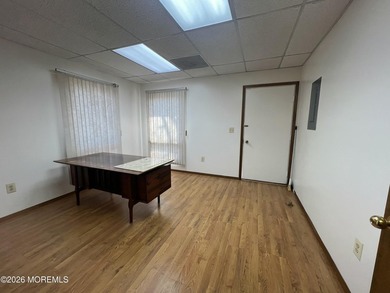 Available a one-story end unit office condo. The unit features - photo 6