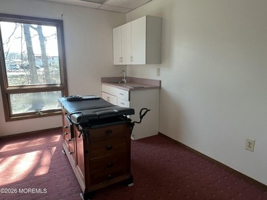 Available a one-story end unit office condo. The unit features - photo 9